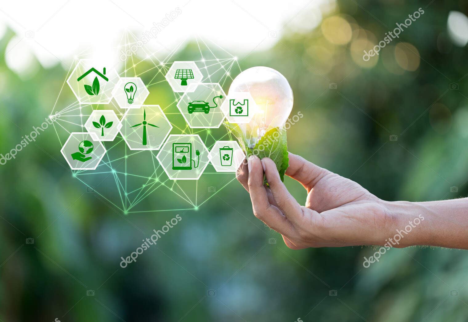 Hand holding light bulb with icons energy sources for renewable,love the world concept.